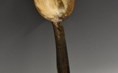 A 19th century horn spoon or ladle, the handle carved