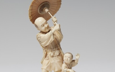 An ivory kimono of a peasant and boy. Late 19th century