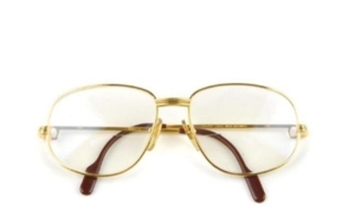 CARTIER - a pair of gold-plated prescription glasses.