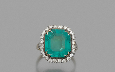 CIRCA 1920 EMERALD RING An emerald, diamond, silver and gold...