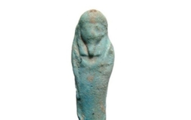 An Egyptian faience light blue ushabti, Late Period