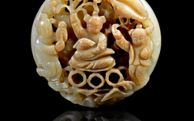 A green and russet jade reticulated circular 'boys' plaque