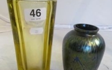 An iridescent glass vase and a modern yellow glass vase