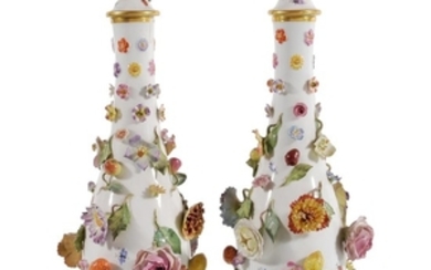 A pair of Meissen slender ovoid flower-encrusted vases and covers