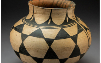 A Santo Domingo Polychrome Jar c. 1910 clay,...