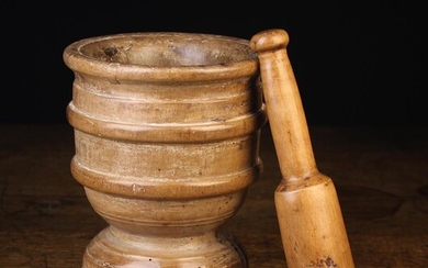 A 17th Century Turned Beechwood Pestle & Mortar. The pestle 9½'' (24 cm) in length. The mortar with