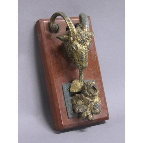 A 19c rams head gilt metal door knocker, 16cm h.