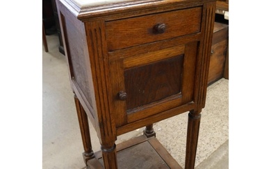 A 19th Century French oak and marble topped table de nuit