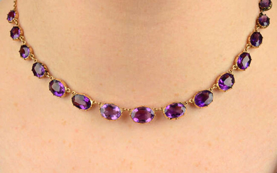 A 19th century gold graduated amethyst rivière necklace, with chain-link back-chain.
