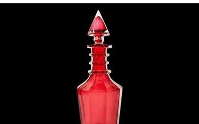A 19th century ruby glass decanter. With facet cut body and ...