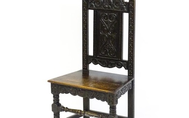 A 19thC carved oak side chair with floral carving, a planked...