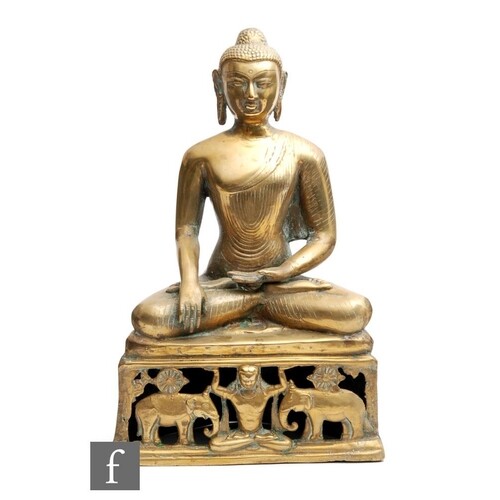 A 20th Century Tibetan Century cast polished metal figure of...