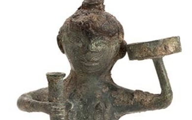 A BRONZE ANTROPOMORPHIC OIL LAMP China, Han dynasty The figure...