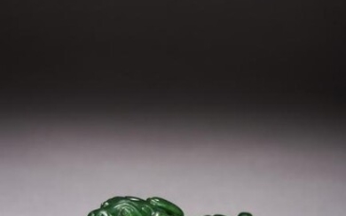 A CHINESE GREEN JADE CARVED BEAST PAPERWEIGHT
