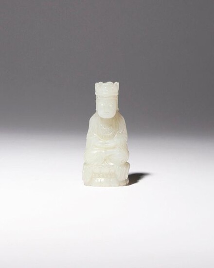 A CHINESE PALE CELADON JADE CARVING OF GUANYIN QING DYNASTY...