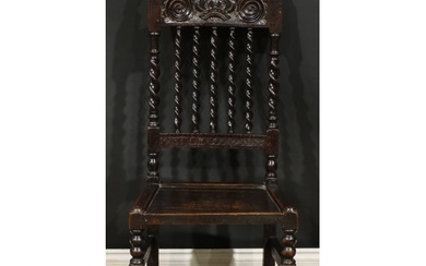 A Charles II oak side chair, curved cresting rail carved wit...