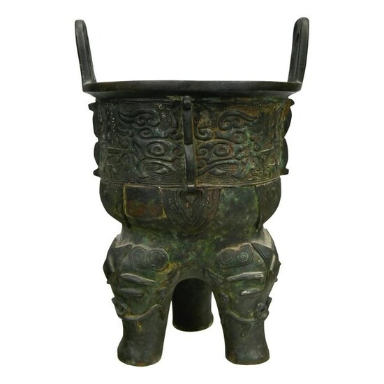 A Chinese Archaic Shang Style Bronze Tripod Vessel
