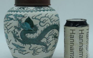 A Chinese Qing Dynasty porcelain Jar with hardwood cover decorated with a Dragon 18cm.