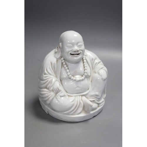 A Chinese blanc de chine porcelain model of Budai, height 16...