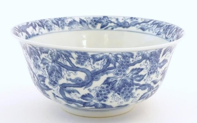 A Chinese blue and white bowl decorated with vine