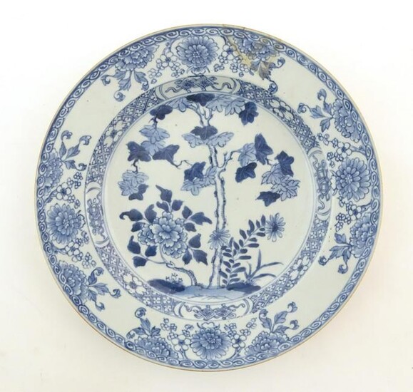 A Chinese blue and white plate decorated with flowers