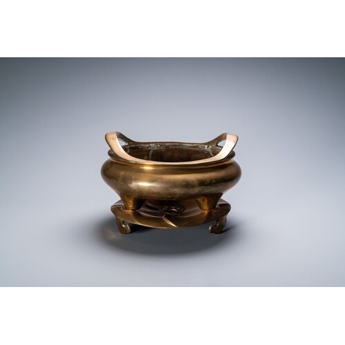 A Chinese bronze tripod censer on stand, Qianlong mark, Qing...