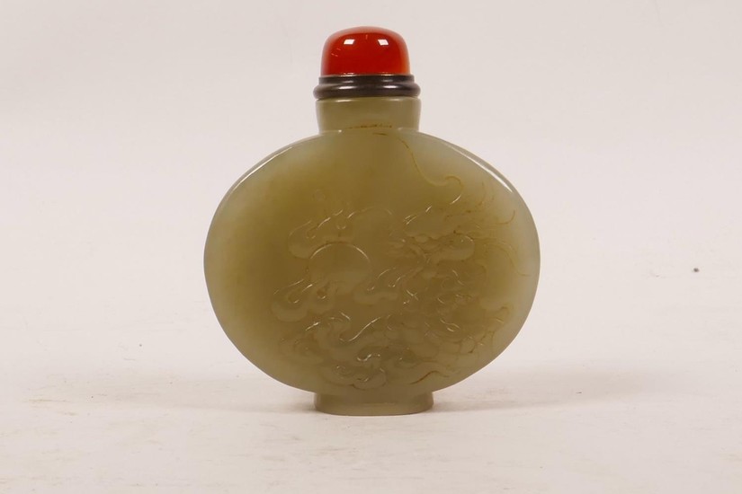 A Chinese celadon jade snuff bottle with carved decoration o...