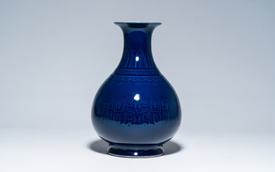 A Chinese monochrome blue vase with underglaze design, 19th/20th C.