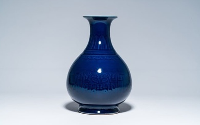 A Chinese monochrome blue vase with underglaze design, 19th/20th C.