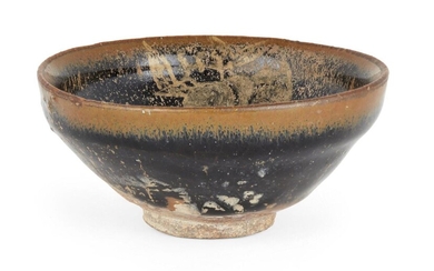A Chinese stoneware Jian 'hare's fur' gilt-painted tea bowl, Song-Jin dynasty, the interior and exterior of the bowl covered with a lustrous black glaze streaked with brown ‘hare’s fur’ markings, the interior later-painted in gilt with three leafy...