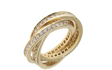 A DIAMOND AND 18CT GOLD TRIPLE BAND RING. formed as three in...