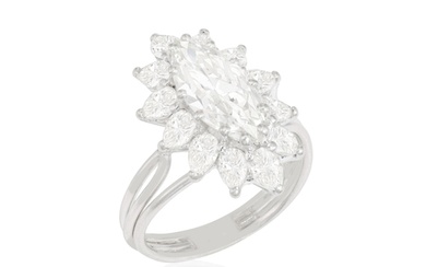 A DIAMOND CLUSTER RING, CIRCA 1960 The marquise-cut diamond...
