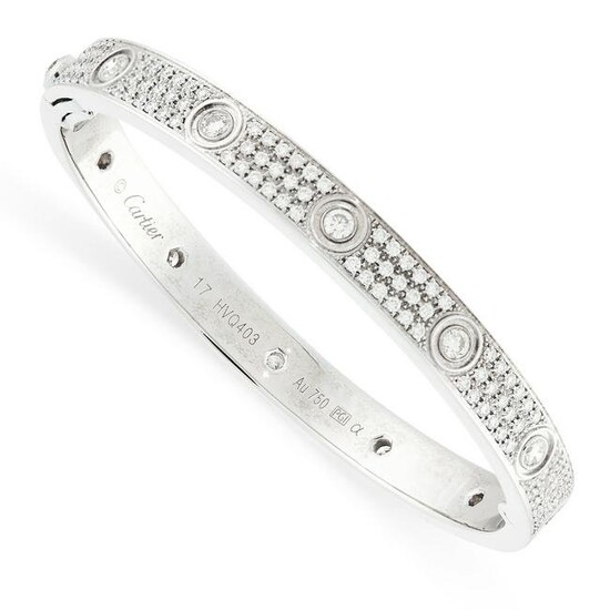 A DIAMOND LOVE BANGLE, CARTIER in 18ct white gold, the hinged bangle pave set with round cut