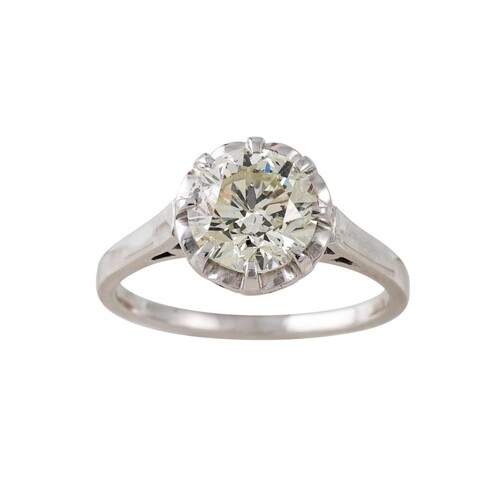A DIAMOND SOLITAIRE RING, the old cut diamonds mounted in 18...