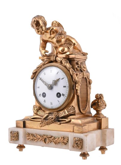 A French gilt metal and marble mounted mantel clock