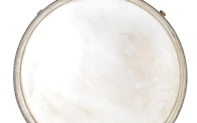 A George III silver salver, London, c.1781, Richard Rugg II, the plain flat base raised on four trefoil-shouldered feet to a double beaded edge, 36.2cm dia., approx. weight 39.9oz