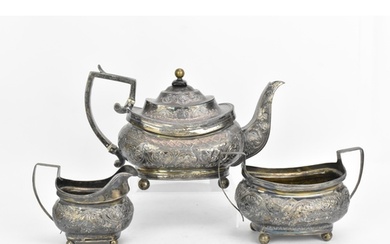 A George III silver three piece tea set, with rubbed hallmar...