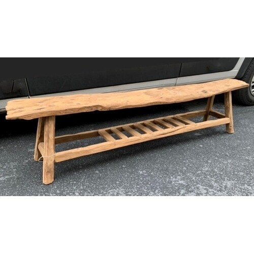 A HANDMADE ELM OUTDOOR BENCH, with shelf beneath, dimensions...