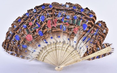 A LATE 19TH CENTURY CHINESE CARVED AND GILDED BONE AND FEATHER FAN Late Qing. 38 cm wide.