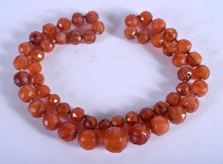 A MIDDLE EASTERN CARNELIAN AGATE NECKLACE. 60 cm long.