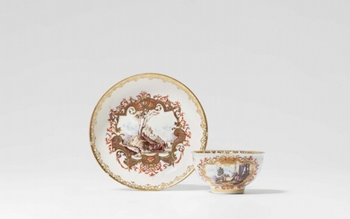 A Meissen porcelain tea bowl and saucer with landscape decor