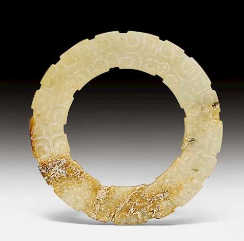 A PARTLY CALCIFIED WHITE-YELLOWISH AND RUSSET JADE HUAN.