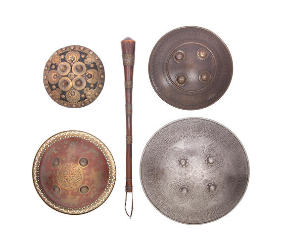 A Persian Circular Steel Dhal, Three Indian Dhals, And An African Club, Mostly 19th Century