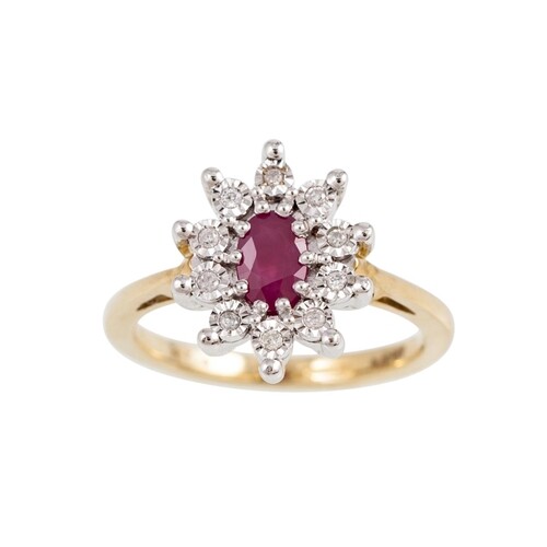 A RUBY AND DIAMOND CLUSTER RING, the oval ruby to an illusio...