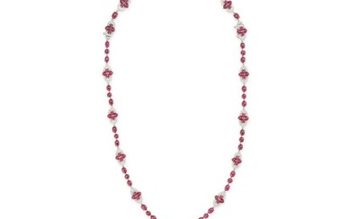 A RUBY AND DIAMOND PENDANT NECKLACE in 18ct white gold, comprising a row of round and oval caboch...
