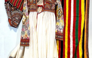 A Rabari embroidered jacket, a Gujarati Budjodi, and pair of Boy's trousers