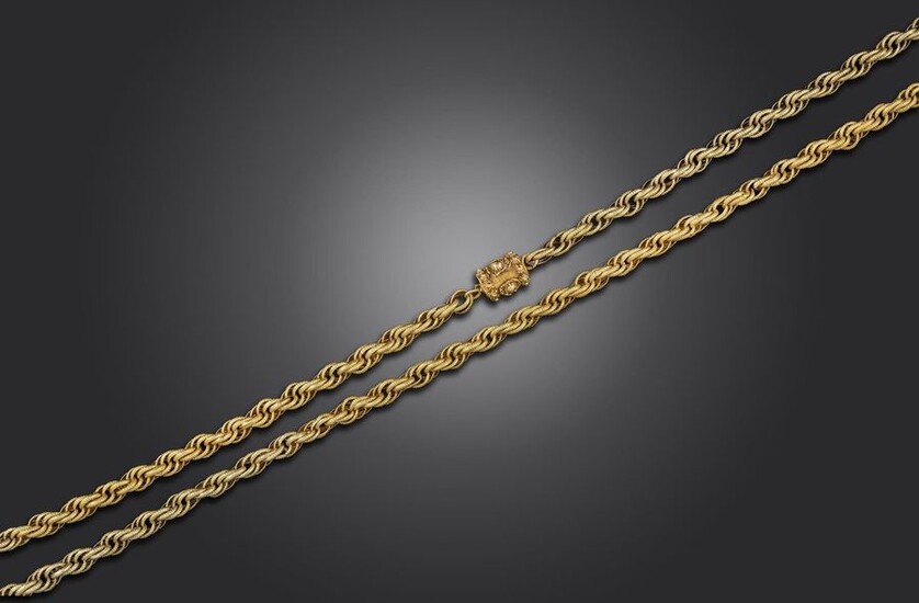 A Regency long guard chain, the twisted circular links with granular decoration in yellow gold, the barrel-shaped claps set with seed pearls, 79cm long, 32g