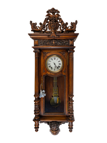 A Renaissance Revival Carved Walnut Regulator Clock