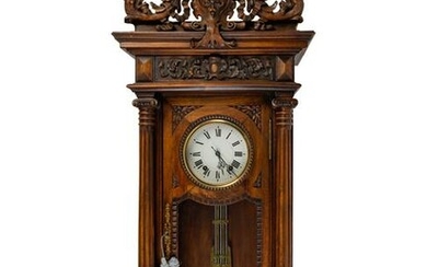 A Renaissance Revival Carved Walnut Regulator Clock