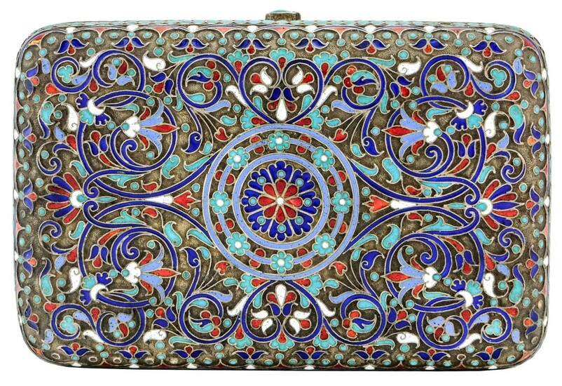 A Russian Silver and Cloisonné Enamelled Cigarette Box Elaborate enamelling throughout. Gilded...